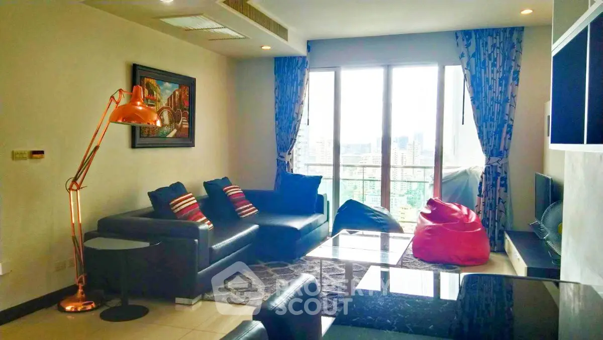 Spacious living room with modern decor and city view