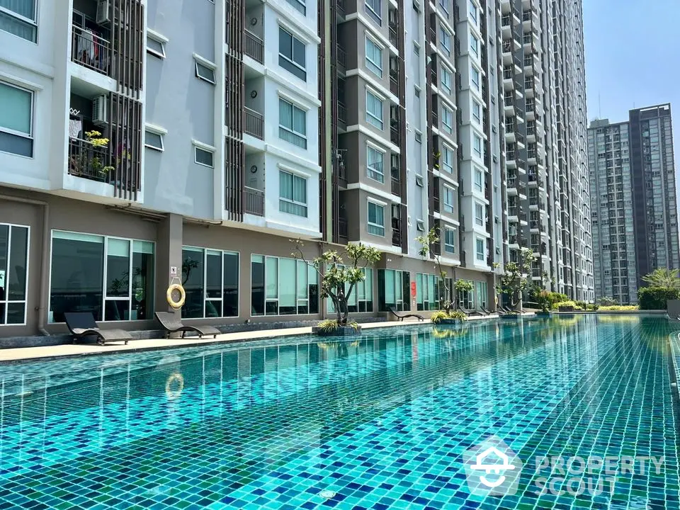 Luxurious condominium with stunning poolside view and modern architecture.