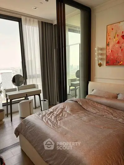 Luxurious bedroom with modern decor and stunning city view from the balcony.