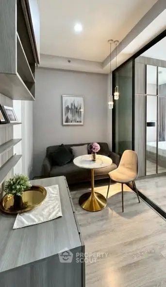 Modern living room with elegant decor and stylish furniture in a cozy apartment setting.