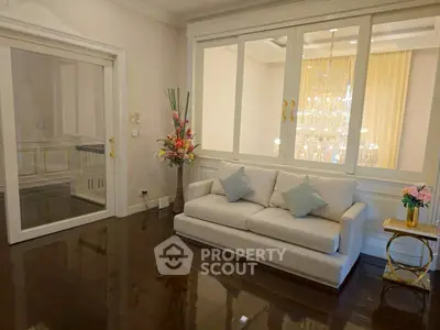 Elegant living room with plush sofa and decorative lighting, perfect for luxury living.