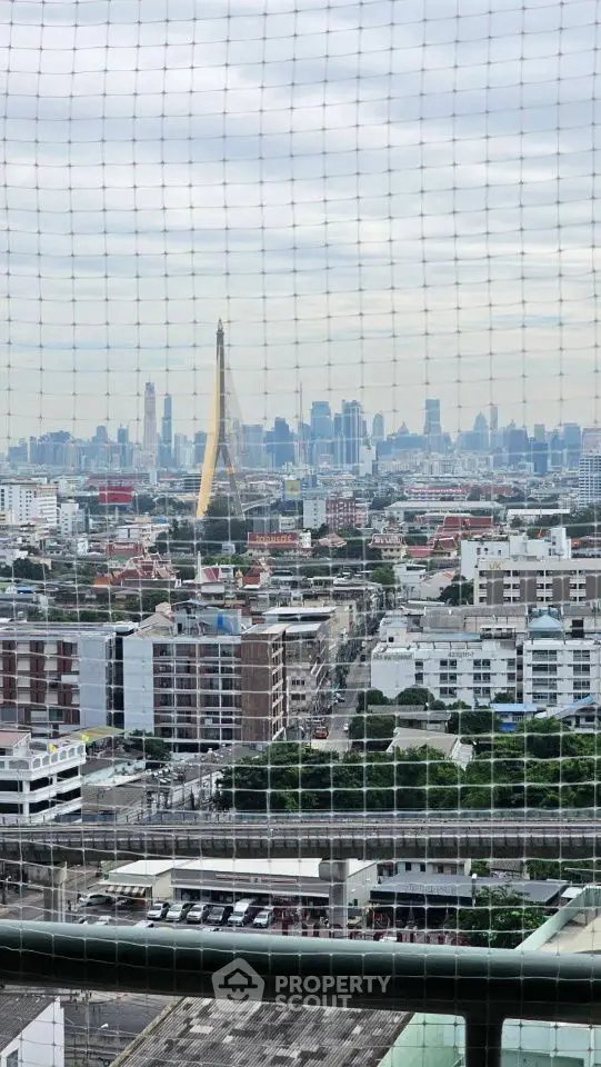 Stunning cityscape view from high-rise building with expansive skyline and iconic bridge.