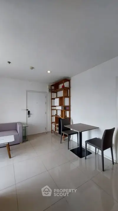 Modern living room with sleek furniture and minimalist design, perfect for urban living.