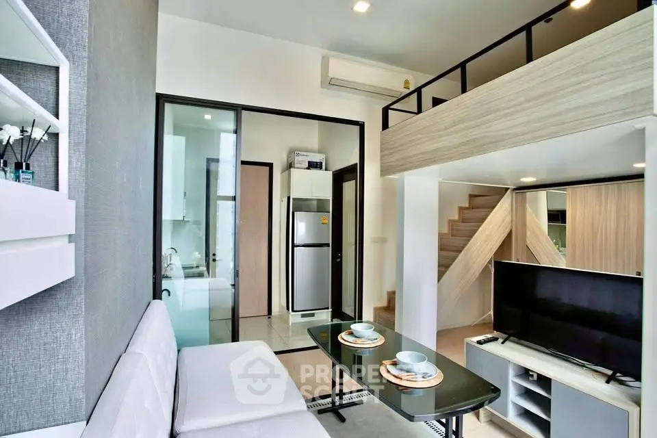 Modern loft-style living room with mezzanine, sleek furniture, and open kitchen design.