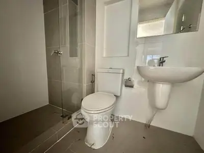 Modern bathroom with sleek fixtures and glass shower enclosure