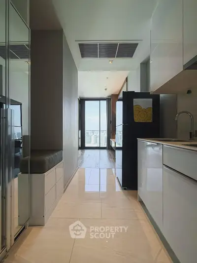 Modern kitchen with sleek design and city view from window