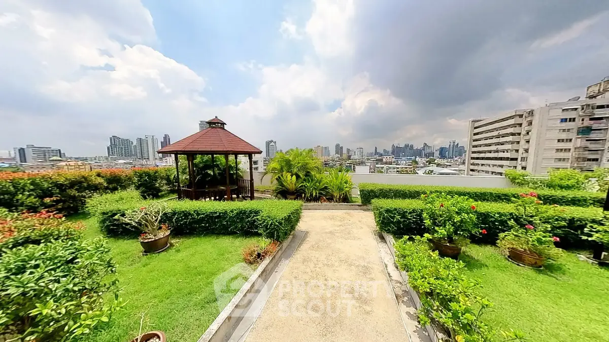 Stunning rooftop garden with city skyline view, perfect for relaxation and entertainment.