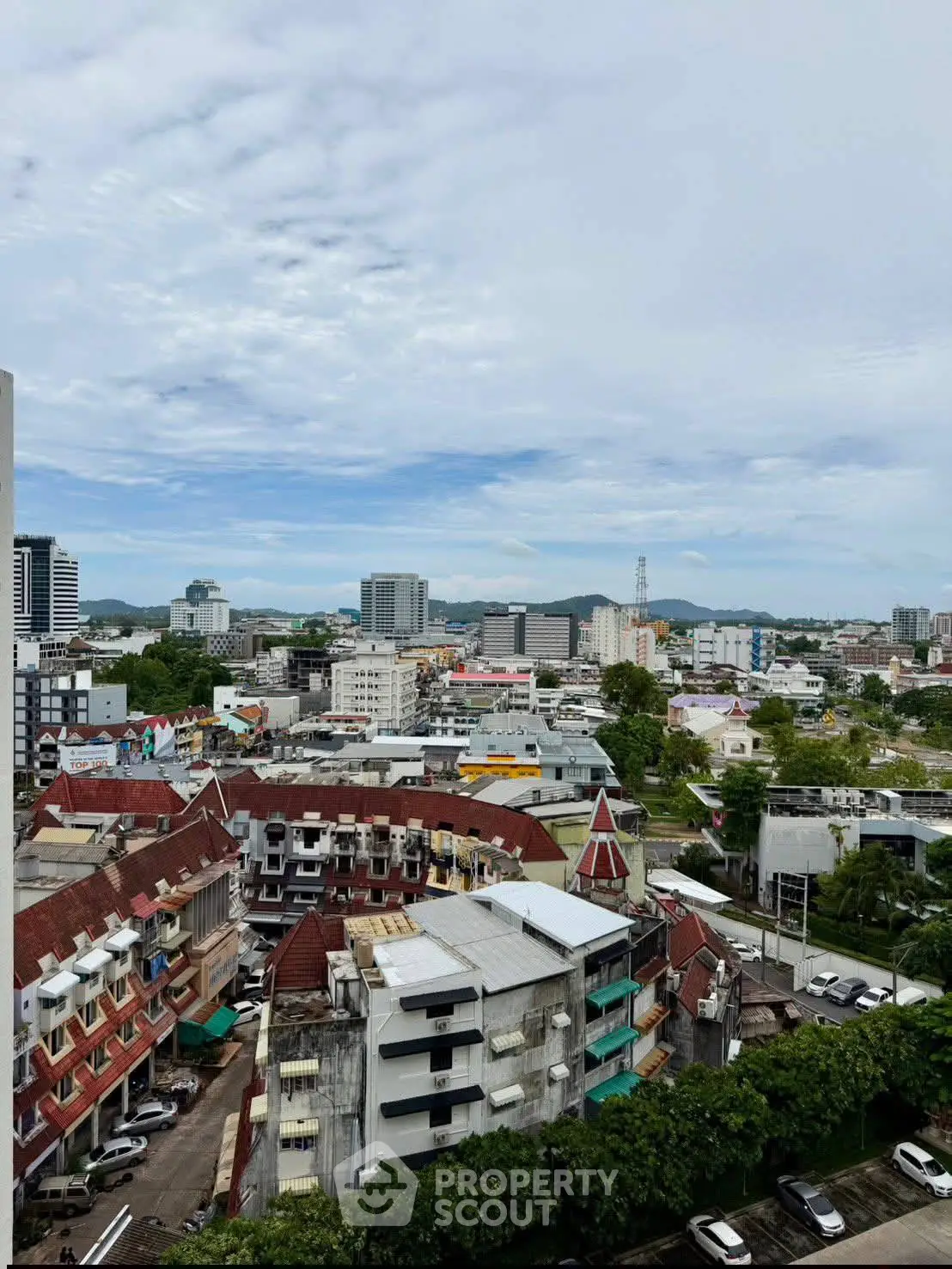 Stunning cityscape view from a high-rise building showcasing urban architecture and skyline.