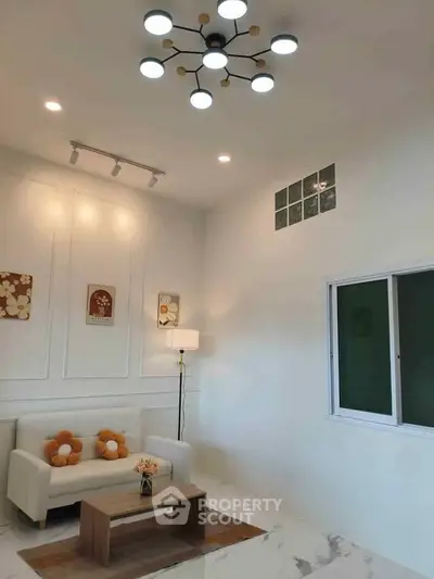 Modern living room with stylish lighting and cozy decor