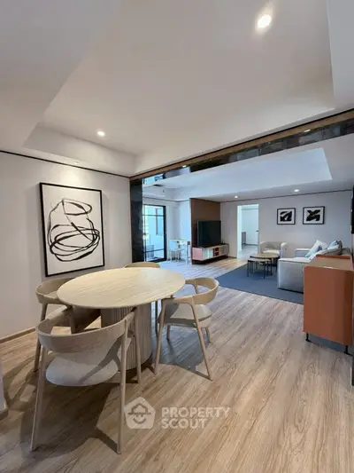 Spacious modern living room with stylish dining area and elegant decor