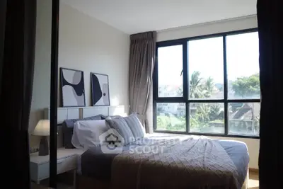 Bright and cozy bedroom with large window and modern decor