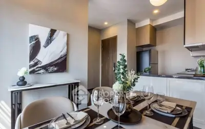 Modern dining area with elegant table setting and contemporary decor in a stylish apartment.
