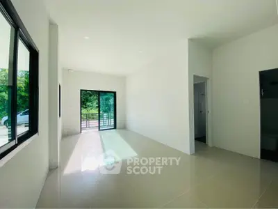 Bright and spacious living room with large windows and modern design