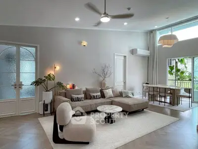 Spacious modern living room with elegant decor and natural light