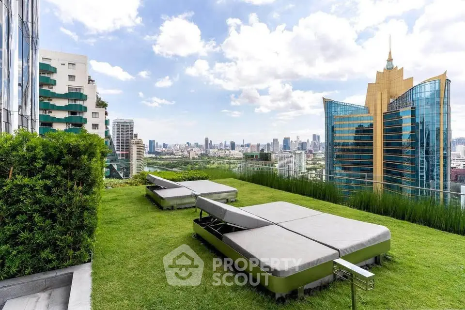 Luxurious rooftop garden with stunning city skyline view, featuring modern lounge beds and lush greenery.