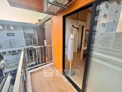 Charming balcony with modern design and city view, perfect for relaxation and enjoying the outdoors.