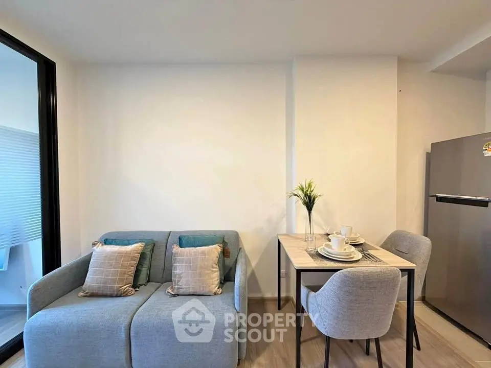 Modern living room with cozy sofa and dining area in stylish apartment
