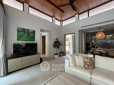 Luxurious modern living room with high ceilings and open kitchen layout, perfect for entertaining.