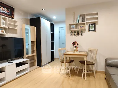 Cozy living room with modern decor and dining area