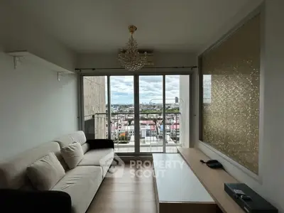 Modern living room with stunning city view and elegant chandelier
