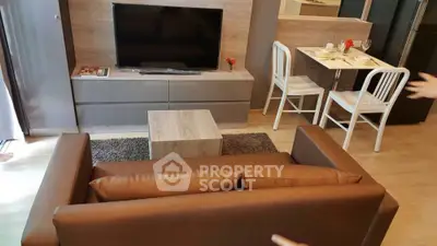 Modern living room with sleek furniture and cozy dining area, perfect for urban living.