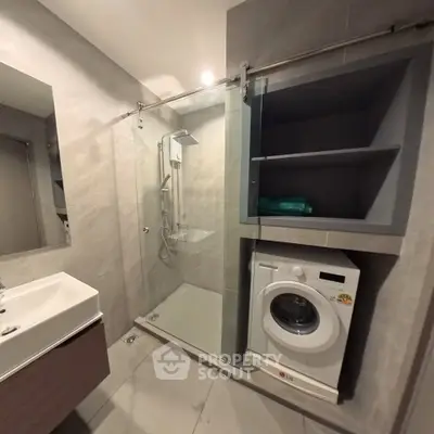 Modern bathroom with shower and washing machine in sleek design
