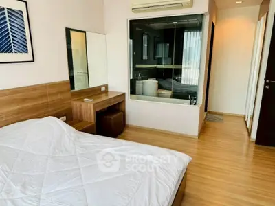 Modern bedroom with wooden flooring and large glass window, featuring a cozy bed and stylish decor.