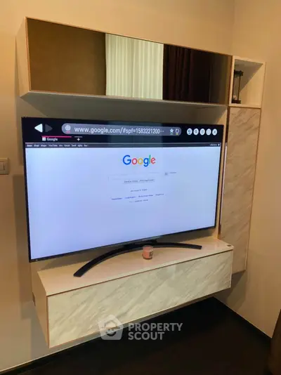 Modern living room with sleek TV unit and stylish decor