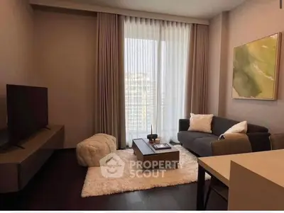 Modern living room with cozy sofa, stylish decor, and large window with city view.