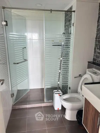 Modern bathroom with glass shower and sleek fixtures