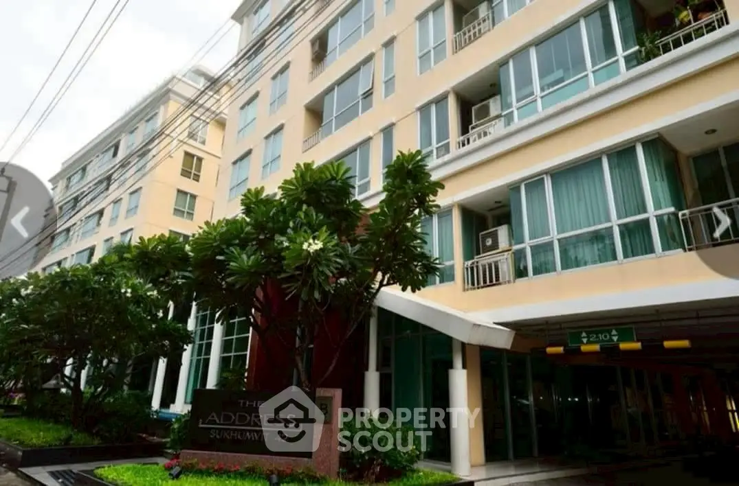 Modern condominium building with lush greenery at The Address Sukhumvit 42