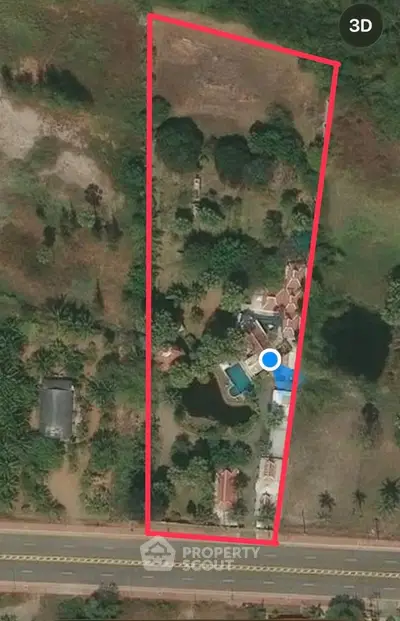 Aerial view of a spacious property with lush greenery, a swimming pool, and multiple structures, ideal for luxury living.