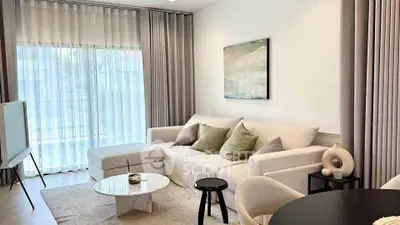 Elegant living room with modern decor and natural light