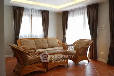 Charming living room with wicker furniture and natural light