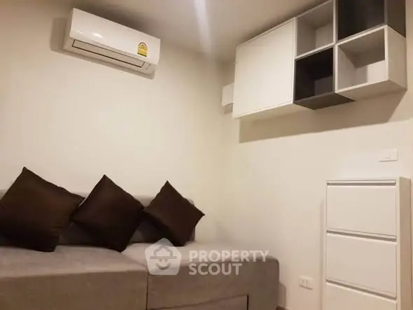 Modern living room with sleek air conditioning and stylish shelving