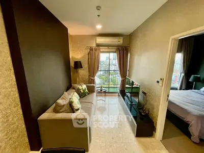 Modern living room with cozy sofa and city view from balcony