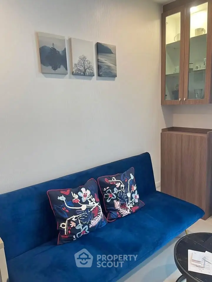 Chic living room with blue sofa and elegant decor