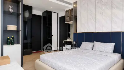 Modern bedroom with stylish decor and ample storage in luxury apartment