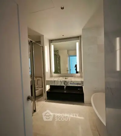 Luxurious modern bathroom with marble finishes and elegant lighting