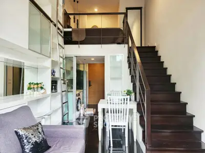 Modern loft apartment with stylish mezzanine and sleek staircase