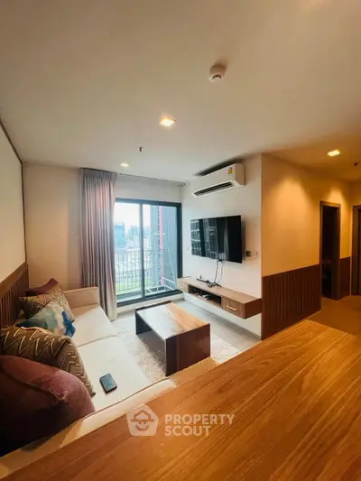 Spacious modern living room with balcony view and stylish decor