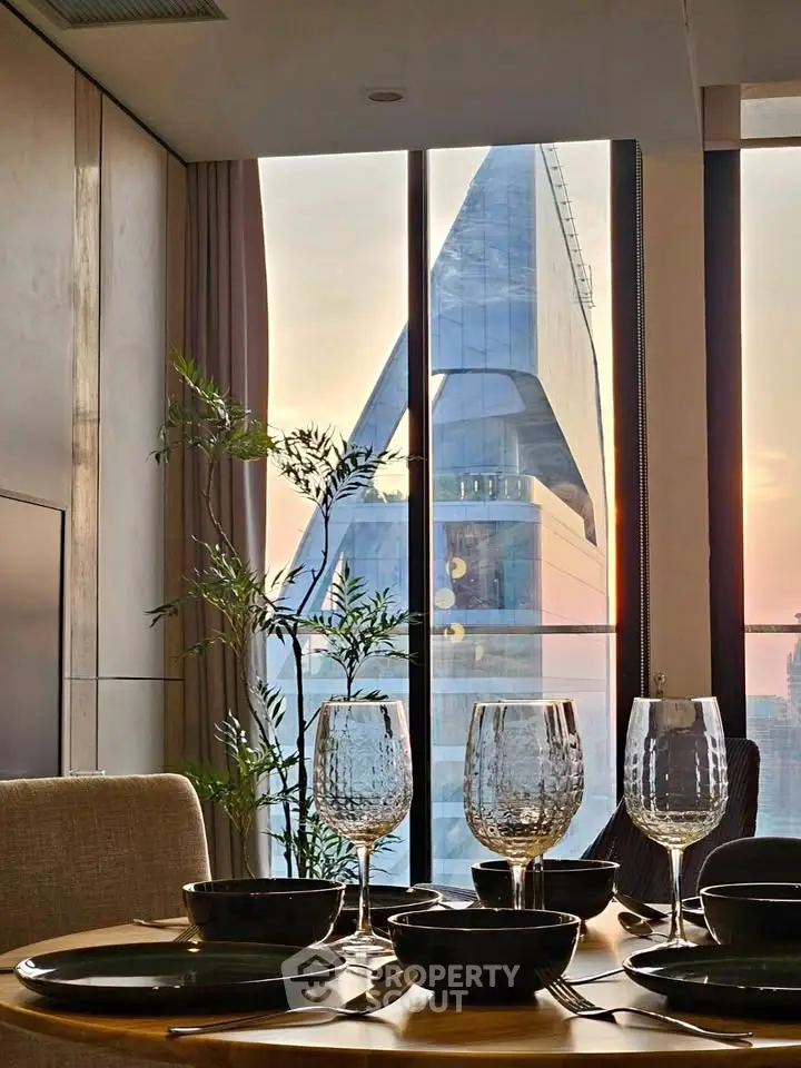 Luxurious dining area with stunning cityscape view through large windows, elegant table setting, and modern decor.