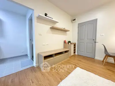 Modern living room with wooden flooring and minimalist furniture