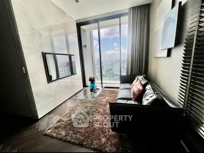 Luxurious living room with stunning city view, modern decor, and plush furnishings.