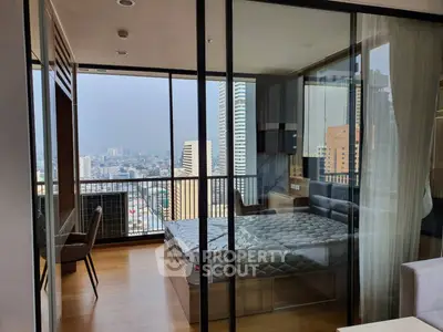 Luxurious bedroom with stunning city view and glass walls in modern apartment