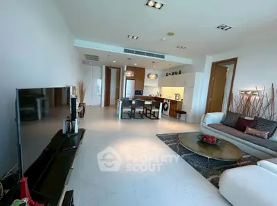 Spacious modern living room with open kitchen and stylish decor