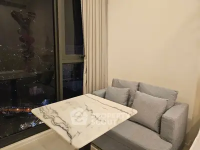 Cozy living room corner with marble table and city view