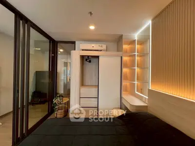 Modern bedroom with sleek design, featuring built-in wardrobe and ambient lighting.