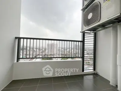 Modern balcony with city view and air conditioning unit, perfect for urban living.