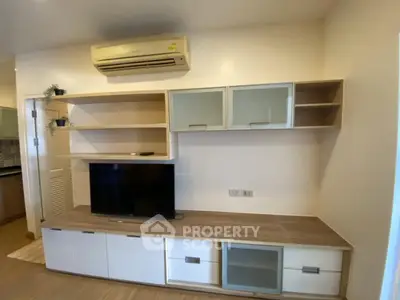 Modern living room with stylish TV cabinet and air conditioning unit